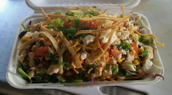 Taco Salad with roasted corn salsa, queso fresco and chipotle crema